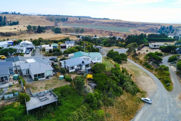 Drone photo of old bach before renovation and extension by Code Construction