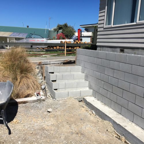 New steps and reinforced retaining wall being built by Code Construction Builders, Akaroa