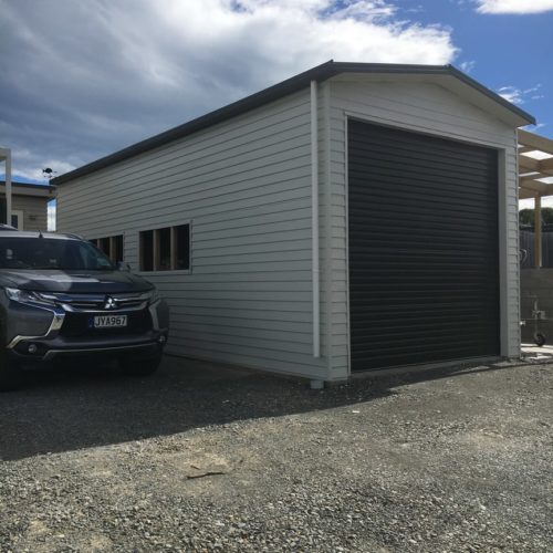 New modern garage and boat shed completed with covered lean to. Completed by Code Construction in Akaroa Banks Peninsula