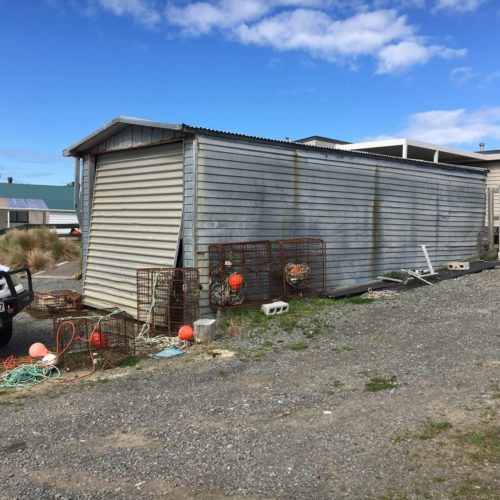 Old garage ready to be removed by Code Construction. New garage and boat shed to be built