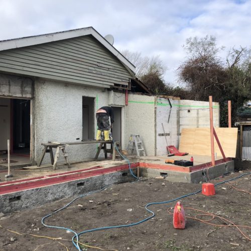 Demolition of existing walls on house to create extension and alteration. Code Construction builders designed and built larger lounge