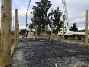 Large shed build in progress in Loburn. Concrete pump is laying concrete over reinforced foundation