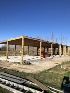 Large six bay shed in Loburn by Code Construction. Photo shows poles in, foundation down and roof on