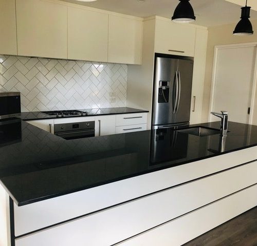 New kitchen as part of new build, designed and built by Code Construction. Included new fencing and deck