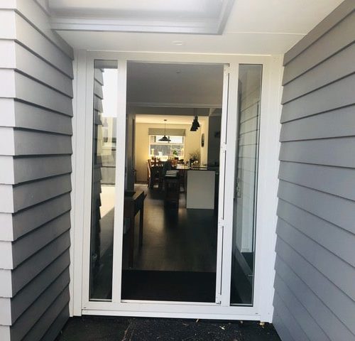 Entrance way of new house designed and built by Code Construction with linear weatherboard