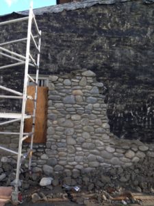 River stones added to building exterior as part of EQC earthquake repair Canterbury