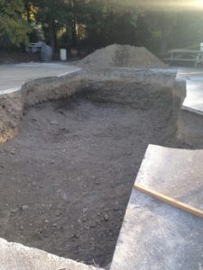 Old pool area dug out in preparation for new pool and outdoor entertainment area