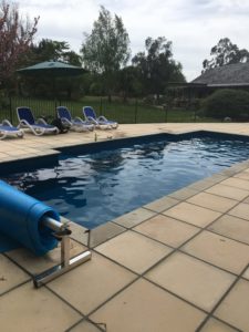 New swimming pool with new paving laid to match Oamaru stone shed