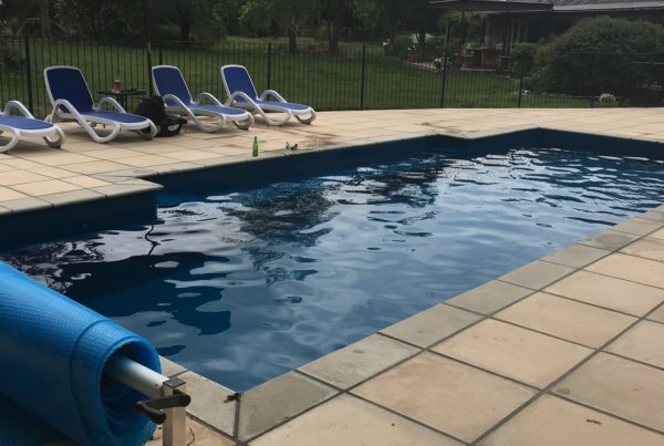 New swimming pool with new paving laid to match Oamaru stone shed