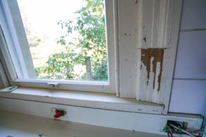 Photo of old wiring and window frame prior to renovation project in North Canterbury