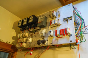 Photo of old power board in heritage house, during renovation