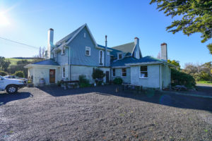 Outside photo of house before renovation and construction in North Canterbury