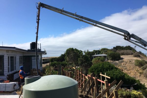 Concrete pump laying new foundation for renovation extension