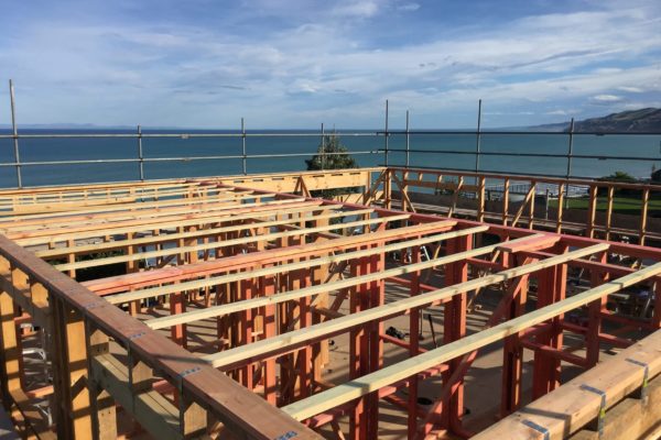 Photo from the roof of a bach renovation and extension. Timber framing complete for walls and roof