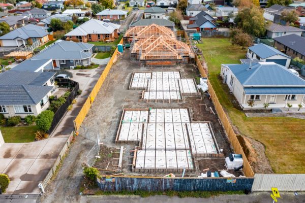 Two foundations prepared for pouring and two frames up for four new builds by Code Construction