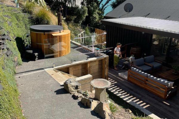 Photo showing newly hill landscaped area for spa pool with retaining wall and steps leading up to it