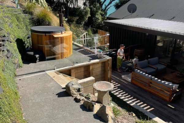 Photo showing newly hill landscaped area for spa pool with retaining wall and steps leading up to it