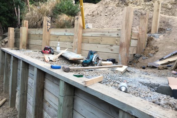 Retaining wall underway prior to completion of landscaping