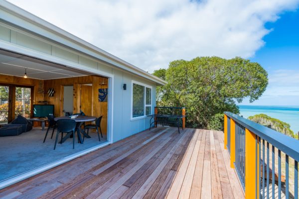 Another angle of the renovation project at Sandy Bay Nelson. New window and door joinery opening out onto newly design and built deck with railing