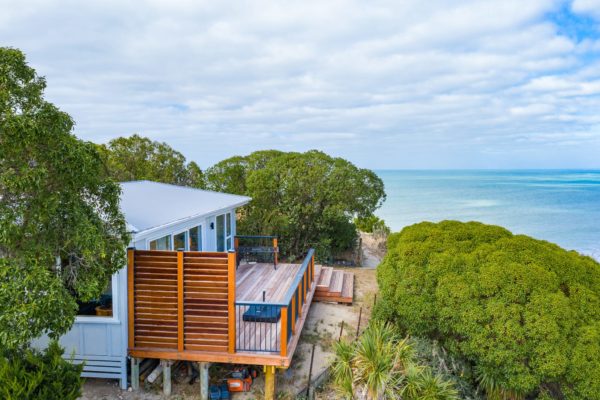 Drone photo of renovation project in Nelson featuring new hardwood deck and hand rail, re-paint exterior