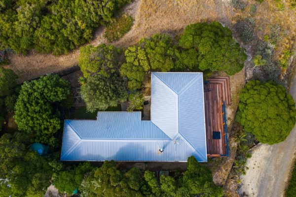 Aerial photo of Nelson bach, recently renovated by Code Construction. Included releveling the house and re-cladding exterior board and batten