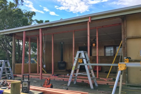 Renovation project showing exterior walls removed and new timber framing in place