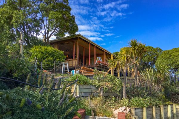 Looking up at the house at Sandy Bay during renovation of exteriors walls and deck