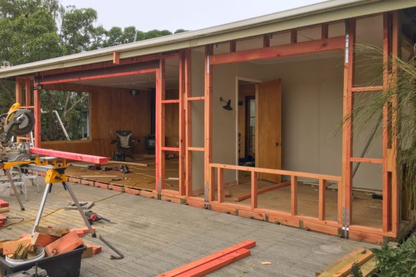 Renovation project underway by Code Construction. Outdoor timber framing in place for two rooms