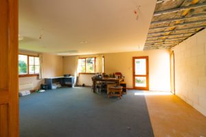 Photo of large room before renovation by Code Construction