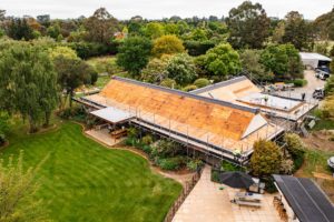 Drone photo of renovation project by Code Construction. Showing new roof being installed