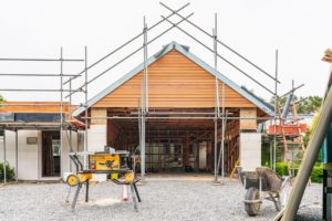 Photo of renovation project by Code Construction. Photo shows garage facade