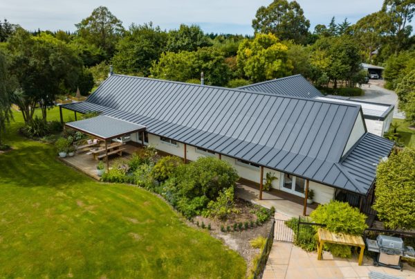 Completed renovation project by Code Construction. New roof on existing house and garage with a louvre system over new deck